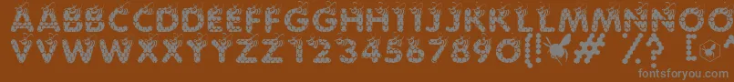 SaveTheHoneybee-fontti – harmaat kirjasimet ruskealla taustalla