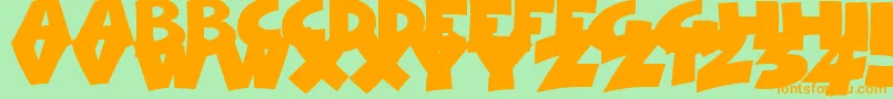 フォントComicalCartoon – オレンジの文字が緑の背景にあります。