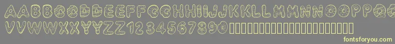Pwyummydonuts-Schriftart – Gelbe Schriften auf grauem Hintergrund