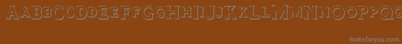 Шрифт Tinplatetitlingshadowed – серые шрифты на коричневом фоне