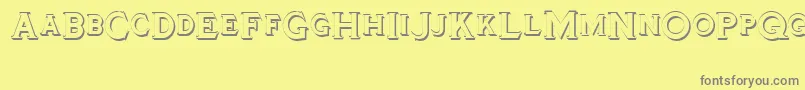 Tinplatetitlingshadowed-Schriftart – Graue Schriften auf gelbem Hintergrund