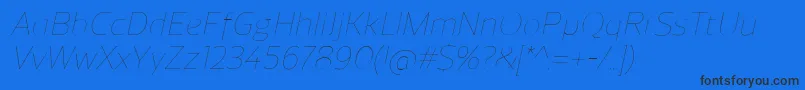 ReganUltralightitalic-Schriftart – Schwarze Schriften auf blauem Hintergrund