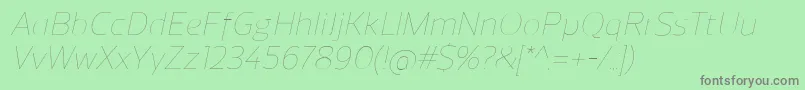 Fonte ReganUltralightitalic – fontes cinzas em um fundo verde