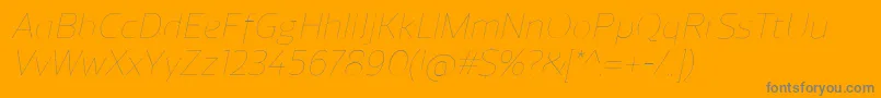 ReganUltralightitalic-Schriftart – Graue Schriften auf orangefarbenem Hintergrund