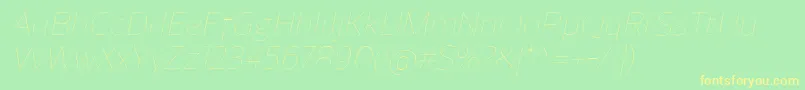 Czcionka ReganUltralightitalic – żółte czcionki na zielonym tle