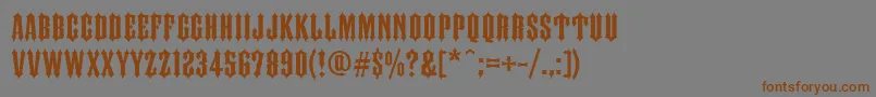 フォントFtyIronhorseNcv – 茶色の文字が灰色の背景にあります。