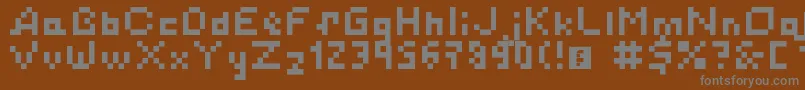 フォントSimplePixelsLatinCyrillicKatakana – 茶色の背景に灰色の文字