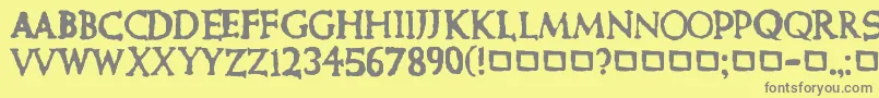 CurePictureShow-fontti – harmaat kirjasimet keltaisella taustalla