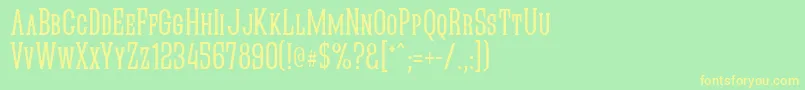 フォントQuasticKapsNarrow – 黄色の文字が緑の背景にあります