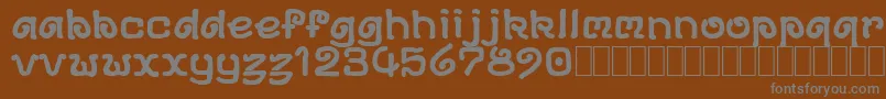 DsArchd-fontti – harmaat kirjasimet ruskealla taustalla