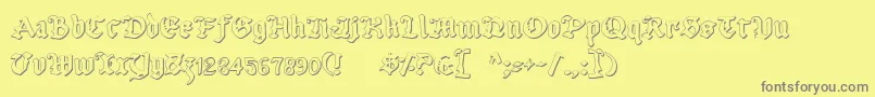 UberhГ¶lmeOutline Font – Gray Fonts on Yellow Background