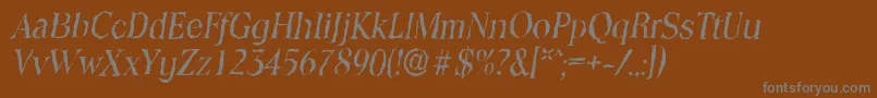 ToledorandomItalic-fontti – harmaat kirjasimet ruskealla taustalla