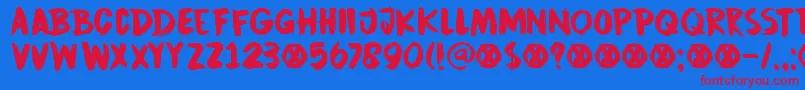 Czcionka DkCinnabarBrush – czerwone czcionki na niebieskim tle