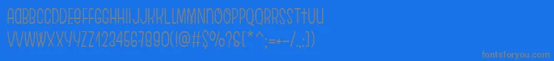 フォントEscalopeSoft – 青い背景に灰色の文字