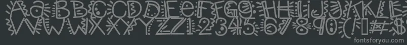 Manicpopthrill-fontti – harmaat kirjasimet mustalla taustalla