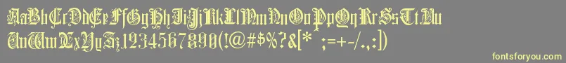 ColchesterBlack-Schriftart – Gelbe Schriften auf grauem Hintergrund