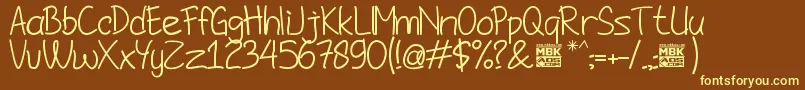 JombloNgenes Font – Yellow Fonts on Brown Background