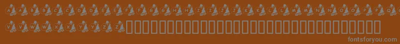 フォントKrSweatinSanta – 茶色の背景に灰色の文字