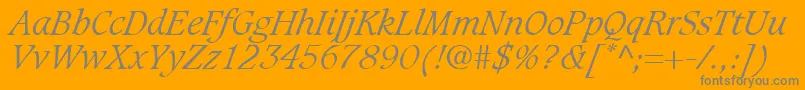 GrammateusLightSsiLightItalic-fontti – harmaat kirjasimet oranssilla taustalla