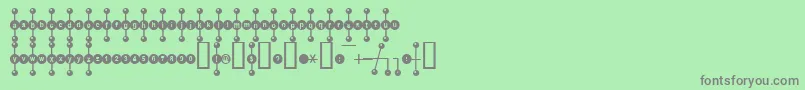 フォントKhole – 緑の背景に灰色の文字