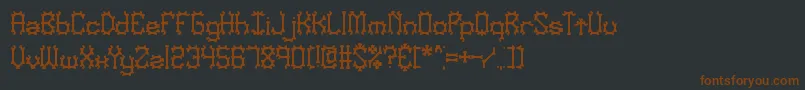 NymonakBrk Font – Brown Fonts on Black Background