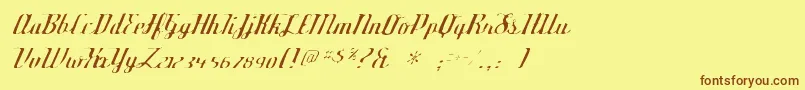 フォントDeftonestylusgaunt – 茶色の文字が黄色の背景にあります。
