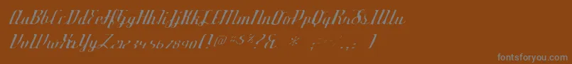 フォントDeftonestylusgaunt – 茶色の背景に灰色の文字