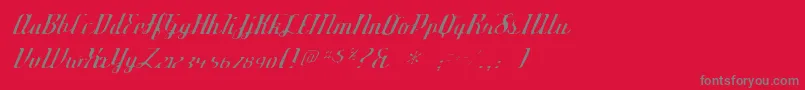 Deftonestylusgaunt-fontti – harmaat kirjasimet punaisella taustalla