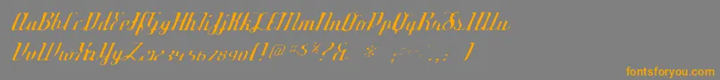フォントDeftonestylusgaunt – オレンジの文字は灰色の背景にあります。