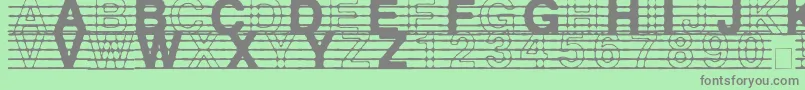フォントDistractedMusician – 緑の背景に灰色の文字