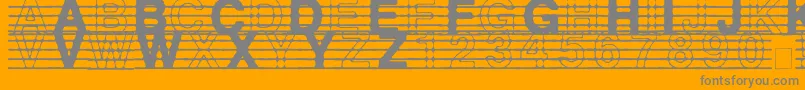 DistractedMusician-fontti – harmaat kirjasimet oranssilla taustalla