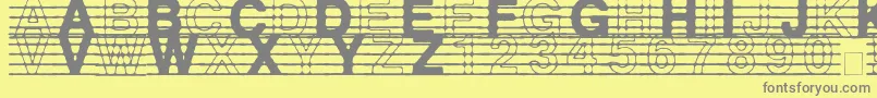 フォントDistractedMusician – 黄色の背景に灰色の文字