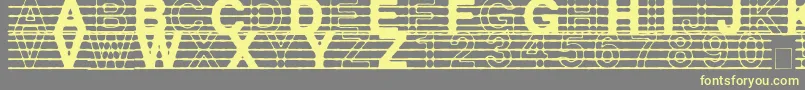 フォントDistractedMusician – 黄色のフォント、灰色の背景