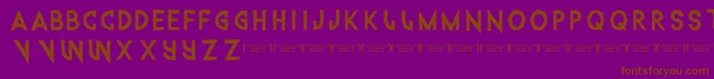 フォントIntothegatorpit – 紫色の背景に茶色のフォント
