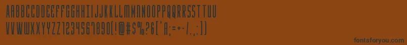 フォントYfilescond – 黒い文字が茶色の背景にあります