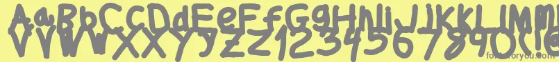 Thickerthan-Schriftart – Graue Schriften auf gelbem Hintergrund