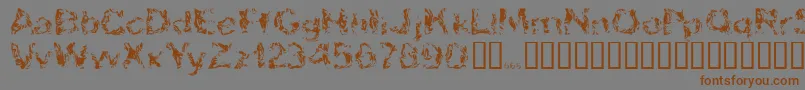 フォントApokalypto – 茶色の文字が灰色の背景にあります。