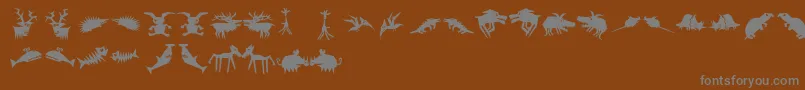 Więcej informacji o czcionce Animaliascissored Czcionka Animaliascissored – szare czcionki na brązowym tle