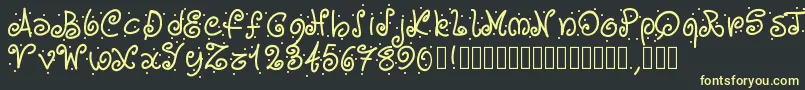 Pwcurvesanddots Font – Yellow Fonts on Black Background
