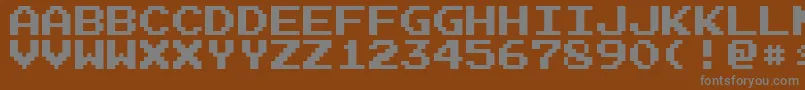 フォントArcadeN – 茶色の背景に灰色の文字