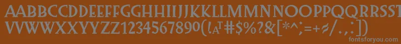 Preissig1918-fontti – harmaat kirjasimet ruskealla taustalla
