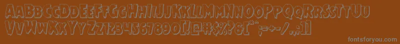 Mrsmonster3D-fontti – harmaat kirjasimet ruskealla taustalla