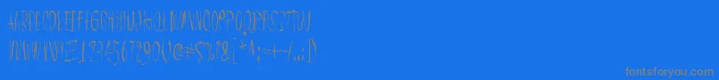 ChicChakZubra-Schriftart – Graue Schriften auf blauem Hintergrund