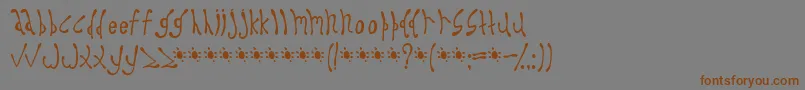 フォントDyspro – 茶色の文字が灰色の背景にあります。