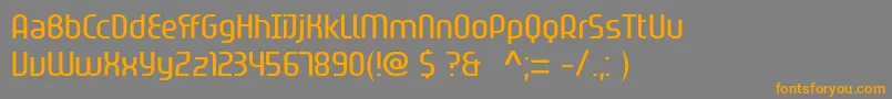 フォントSpionverpflanzung – オレンジの文字は灰色の背景にあります。