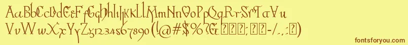 フォントValpuesta – 茶色の文字が黄色の背景にあります。