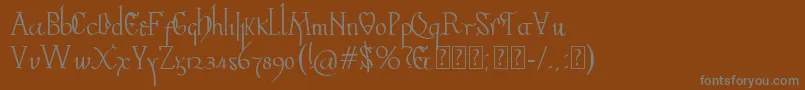 Valpuesta-Schriftart – Graue Schriften auf braunem Hintergrund