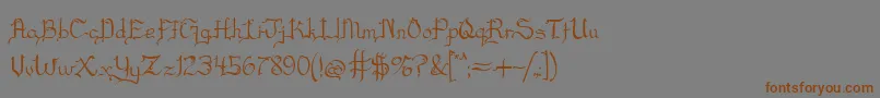 フォントBlackscript – 茶色の文字が灰色の背景にあります。