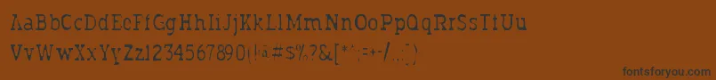 Typodermicgaunt-Schriftart – Schwarze Schriften auf braunem Hintergrund