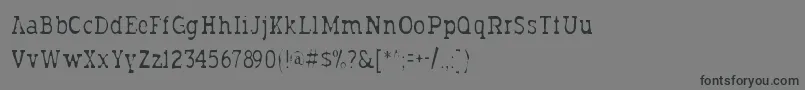 Шрифт Typodermicgaunt – чёрные шрифты на сером фоне